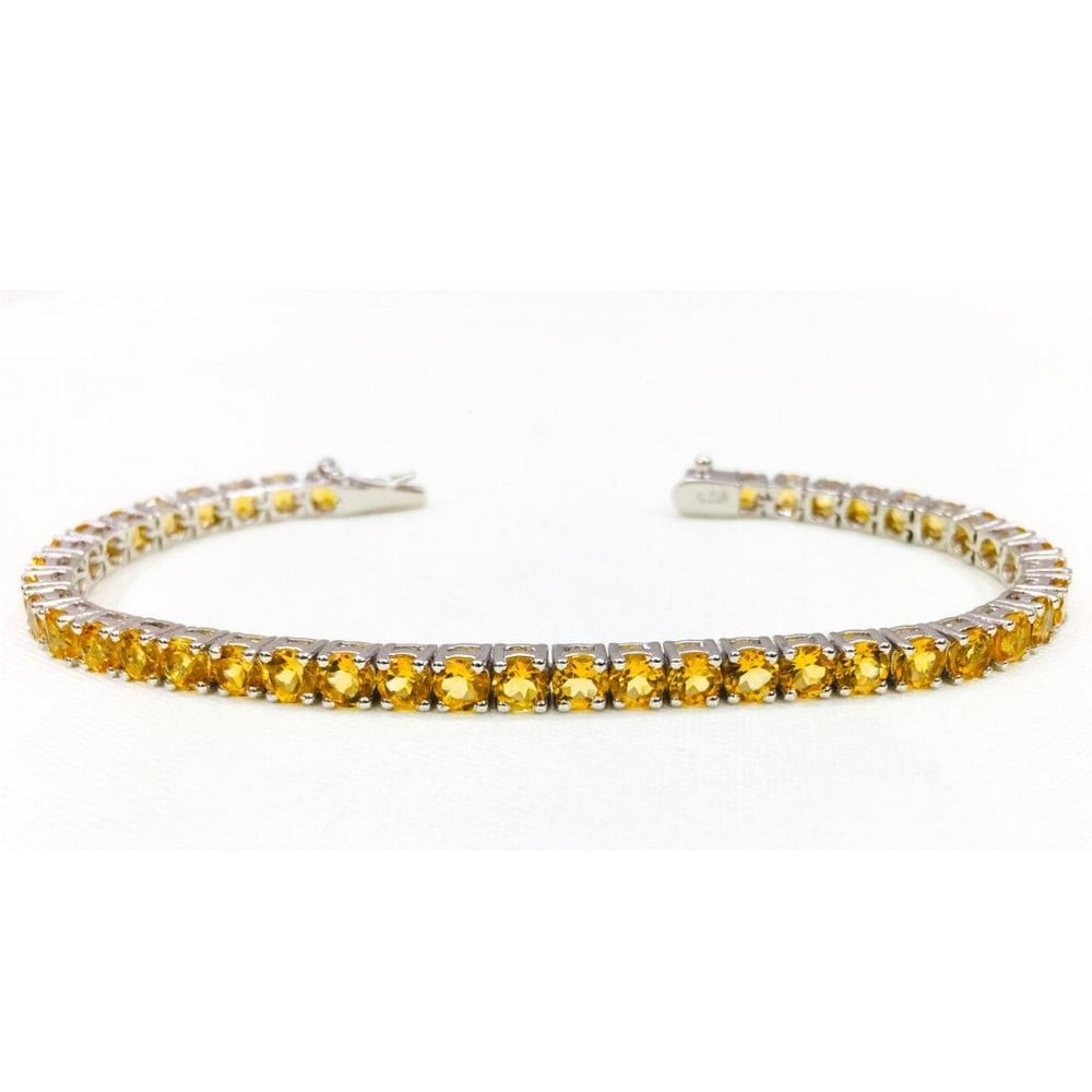 Citrine Stone Studded Bracelet: Citrine Stone Studded Bracelet This bracelet is 925 Sterling Silver and features stunning citrine round faceted gemstones. Size of Gemstones: 4mm View Photos For Further Details