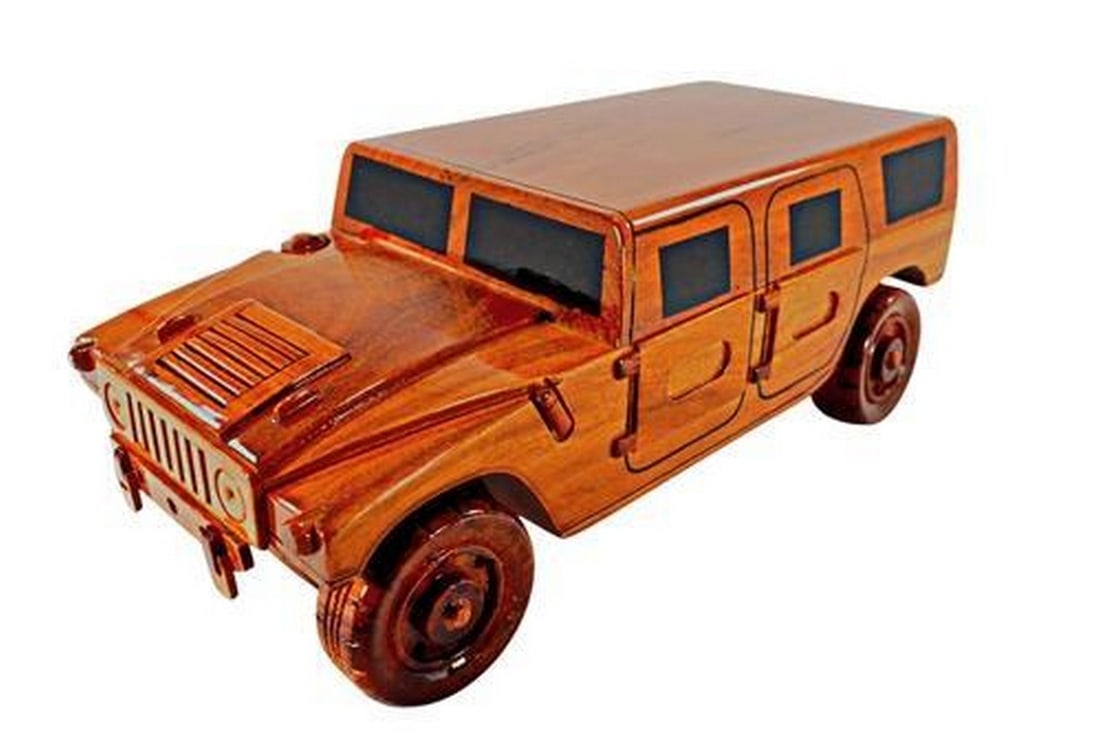 Military Hummer Wooden Model: Military Hummer Wooden Model This military Hummer is handcrafted from solid mahogany and finely detailed. This scale replica is given three coats of polyurethane finish for high gloss and wood