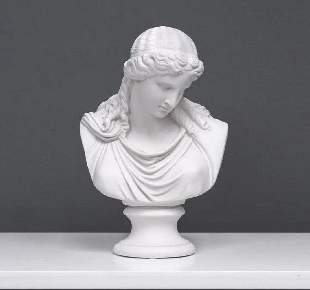 Keeper of Calm: Eirene's Tranquil Bust Sculpture - (7.7lbs): Keeper of Calm: Eirene's Tranquil Bust Sculpture - (7.7lbs) This exquisite marble bust of Eirene, the Greek Goddess of Peace, embodies serenity and harmony. Sculpted with graceful precision,