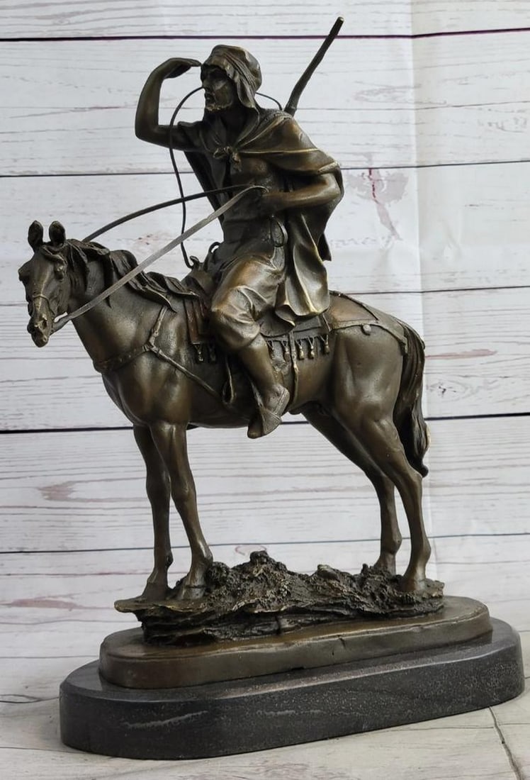 Lawrence of Arabia Bronze Sculpture – 16" x 11": Lawrence of Arabia Bronze Sculpture – 16" x 11" This elegant bronze sculpture portrays an Arabian rider on horseback, capturing the timeless spirit of desert exploration. Dressed in traditio