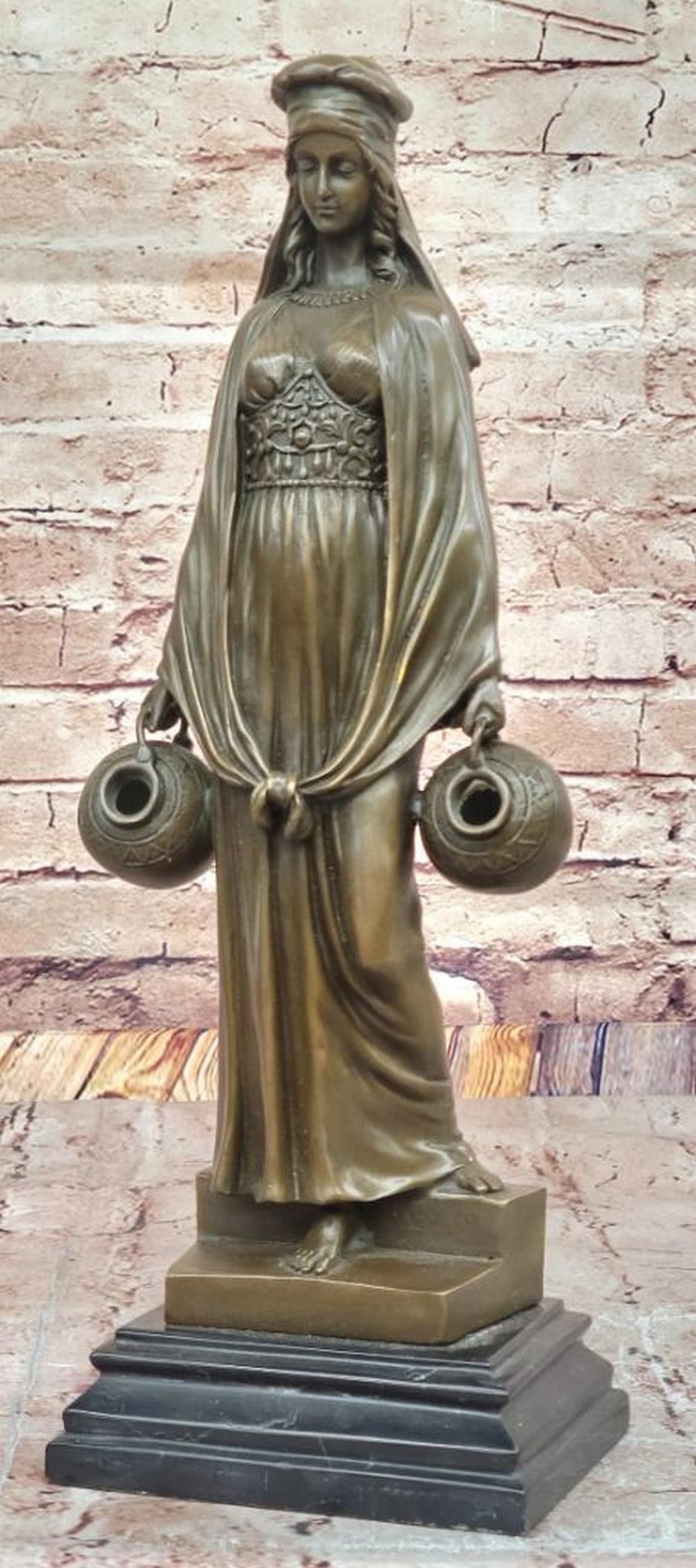 The Water Carrier Bronze Sculpture Inspired by Aldo Vitaleh - 15" x 5.5": The Water Carrier Bronze Sculpture Inspired by Aldo Vitaleh - 15" x 5.5" This exquisite early 20th-century bronze sculpture by Aldo Vitaleh captures the grace and poise of a woman in traditio