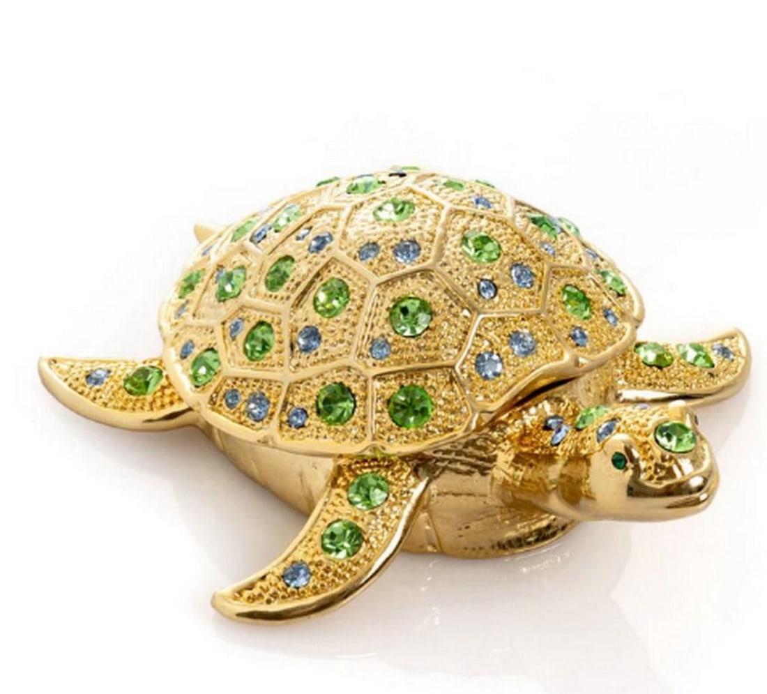 Golden Turtle Enamel Jewelry Box: Golden Turtle Enamel Jewelry Box Delight in the charm of this Golden Turtle enamel jewelry box, exquisitely handcrafted and adorned with handpicked Austrian crystals. Plated in 24K gold or 925