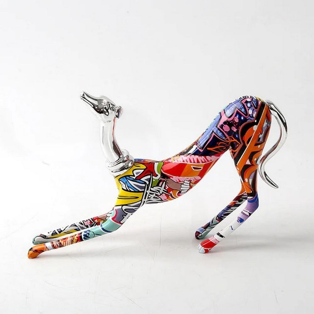 Vibrant Graffiti Greyhound Statue – Stretching Pose: Vibrant Graffiti Greyhound Statue – Stretching Pose Add color and character to your home with this bold Greyhound Graffiti Statue. Crafted from high-quality resin and detailed with vibrant,
