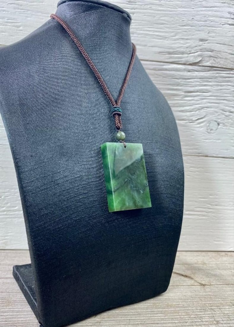 Canadian Nephrite Jade Rectangular Pendant on Adjustable Rope Necklace: Canadian Nephrite Jade Rectangular Pendant on Adjustable Rope Necklace Dimensions: 50mm View Photos For Further Details.