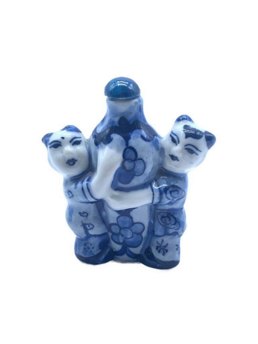 Vintage Hand Painted Porcelain Snuff Bottle from Taiwan: Introducing a captivating work of art, This Porcelain Snuff Bottle featuring an enchanting portrayal of two Taiwanese ladies embracing the bottle. This exquisite snuff bottle transcends mere