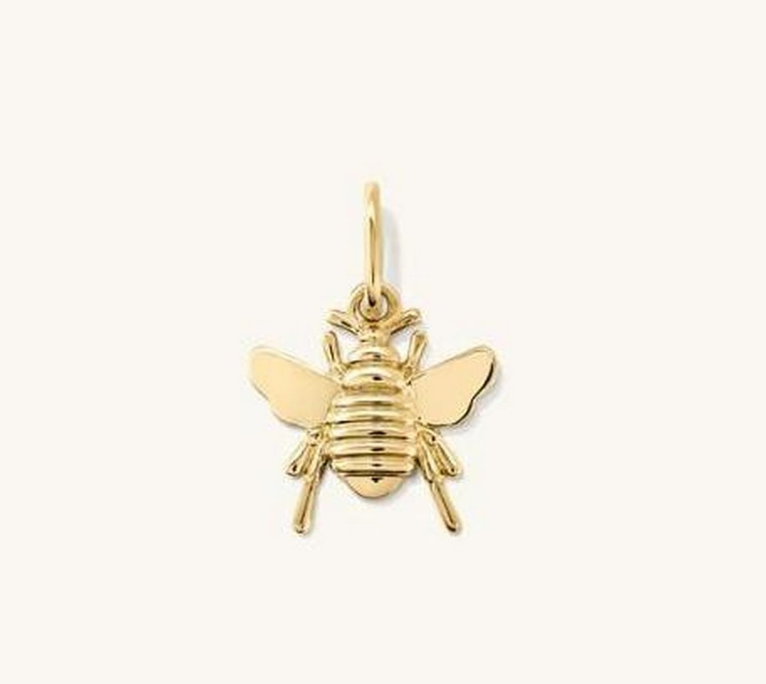 Honeybee Charm: Honeybee Charm This bee charm is as sweet as honey and perfect for everyday wear. Crafted from 14k gold, it features a beautiful, subtle hue that can be worn anywhere, every day. When properly cared