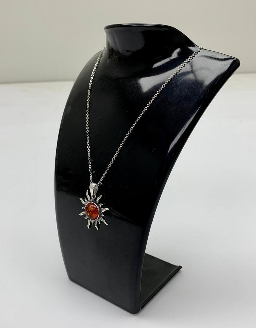 Bright Amber Sun Pendant Necklace: Bright Amber Sun Pendant Necklace. Shine With A Radiance That Only Glows When You Wear This Beautiful Amber Sun Pendant Necklace. This Pendant Is Beautifully Crafted With Vivid Color That Will Give A
