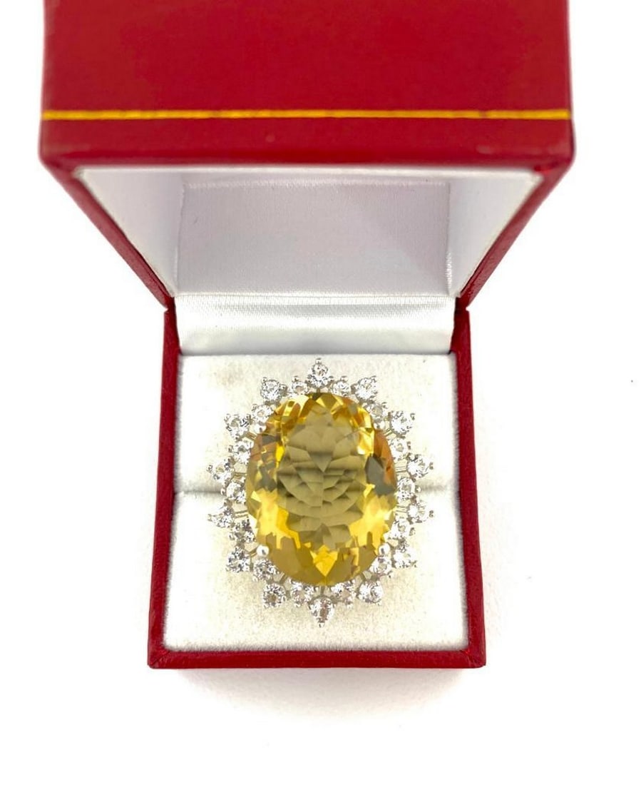 Natural 24.6ct Oval Cut Citrine Ring Surrounded by White Topaz: Natural 24.6ct Oval Cut Citrine Ring Surrounded by White Topaz. Please view photos for further details. 
