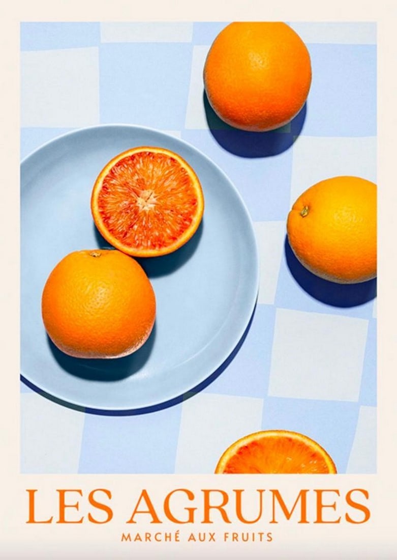Les Agrumes Poster: Les Agrumes Poster Oranges on a blue plate and blue checkered table cloth, and orange text at the bottom. Perfect for a kitchen space. Dimensions: 16" x 20" View Photos For Further