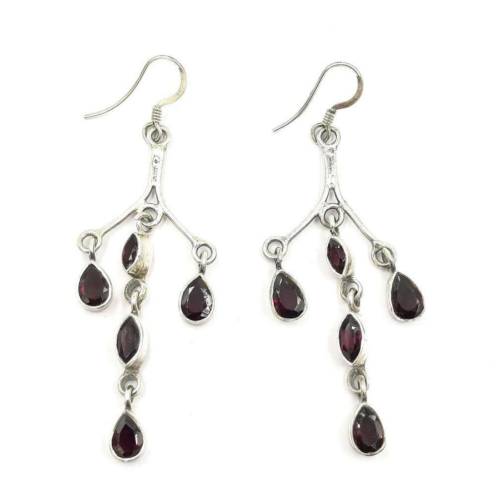 Garnet Gemstone Studded Earrings: Garnet Gemstone Studded Earrings These earrings feature 5 deep coloured garnet gemstones per earring. View Photos For Further Details.