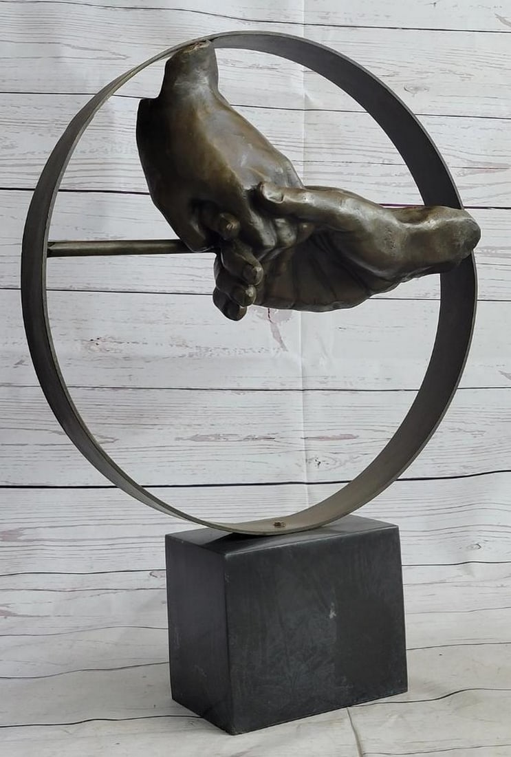 Lingering Handshake Bronze Sculpture: Lingering Handshake Bronze Sculpture This tender handshake bronze sculpture is the perfect elegant piece to add to your decor. This intriguing piece depicting two hands clinging together in a