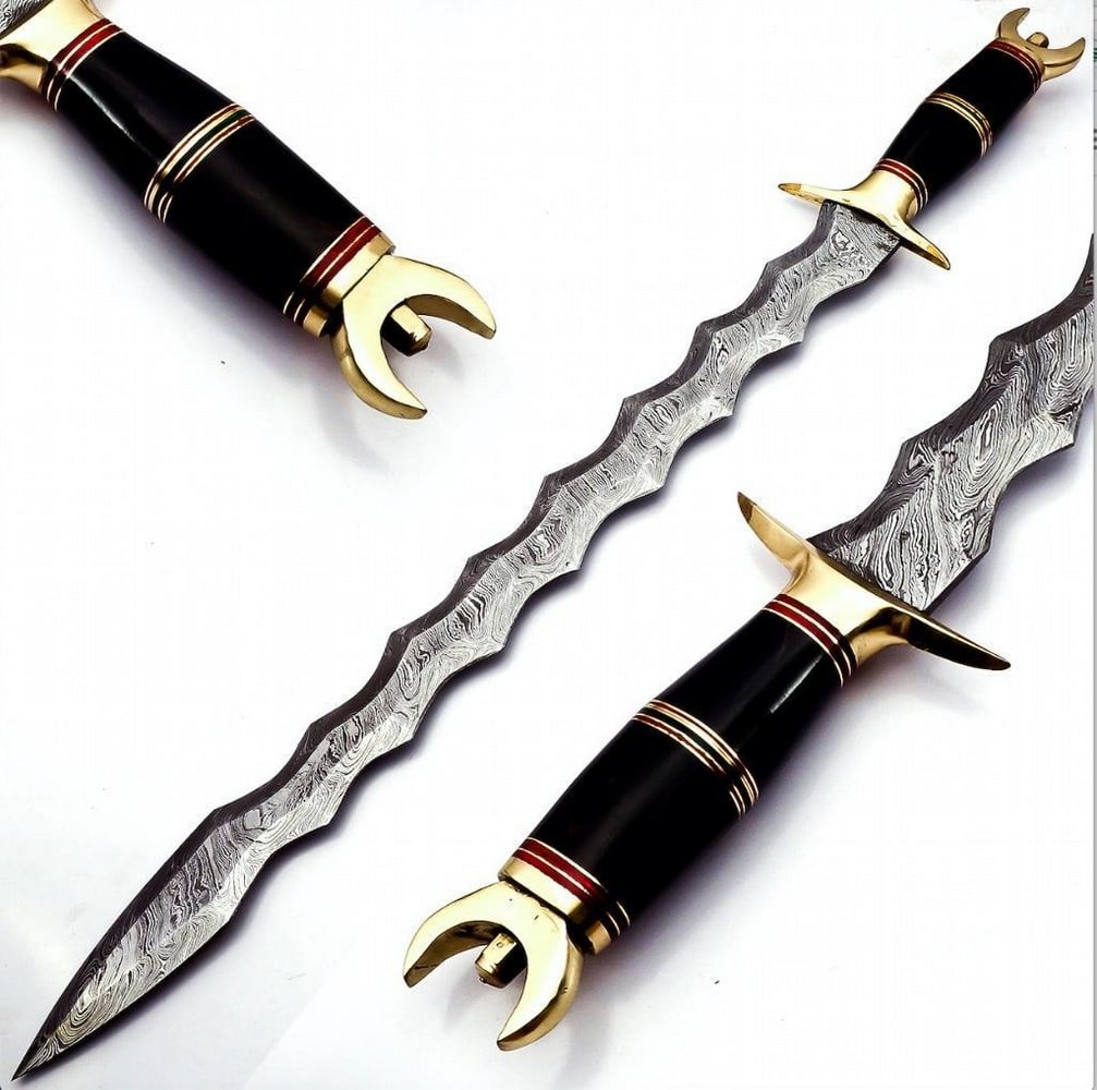 Flame-Bladed Damascus Bastard Sword With Triple Tip Brass Hilt: Flame-Bladed Damascus Bastard Sword With Triple Tip Brass Hilt Behold the Flame-Bladed Damascus Bastard Sword with Triple Tip Brass Hilt—a true embodiment of power and artistry. The Damascus