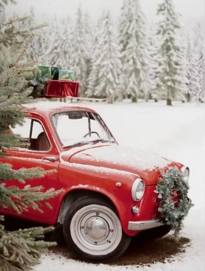 Christmas Journey Canvas Print: Christmas Journey Canvas Print An artwork showing a vintage red car carrying a Christmas tree and gifts, all covered in snow. The composition captures a festive winter scene, perfect for holiday deco