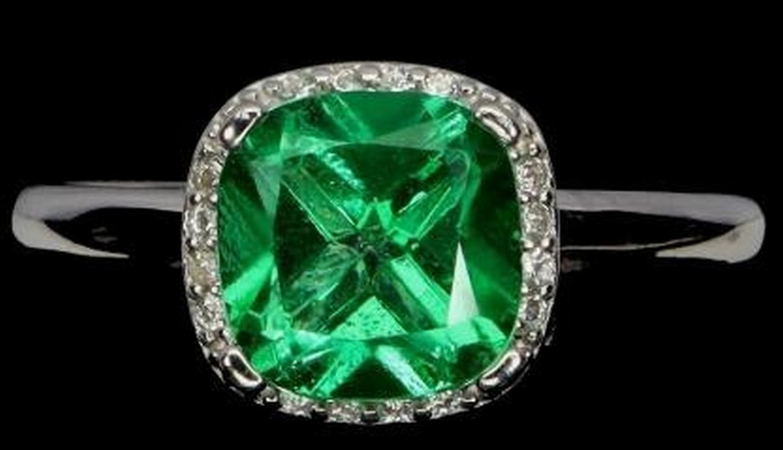 Sterling Silver Cushion Green Topaz Ring: Sterling Silver Cushion Green Topaz Ring This striking sterling silver ring features an 8mm cushion-cut green topaz, radiating vibrant color and brilliance. Set in a polished silver band, the