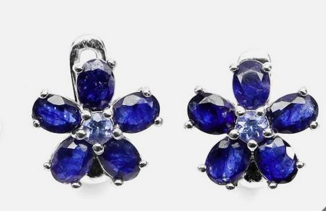 Sterling Silver Pear Blue Sapphire & Tanzanite Earrings: Sterling Silver Pear Blue Sapphire & Tanzanite Earrings These elegant sterling silver earrings feature 4x3mm pear-shaped blue sapphires accented with sparkling tanzanite gemstones. Handcrafted