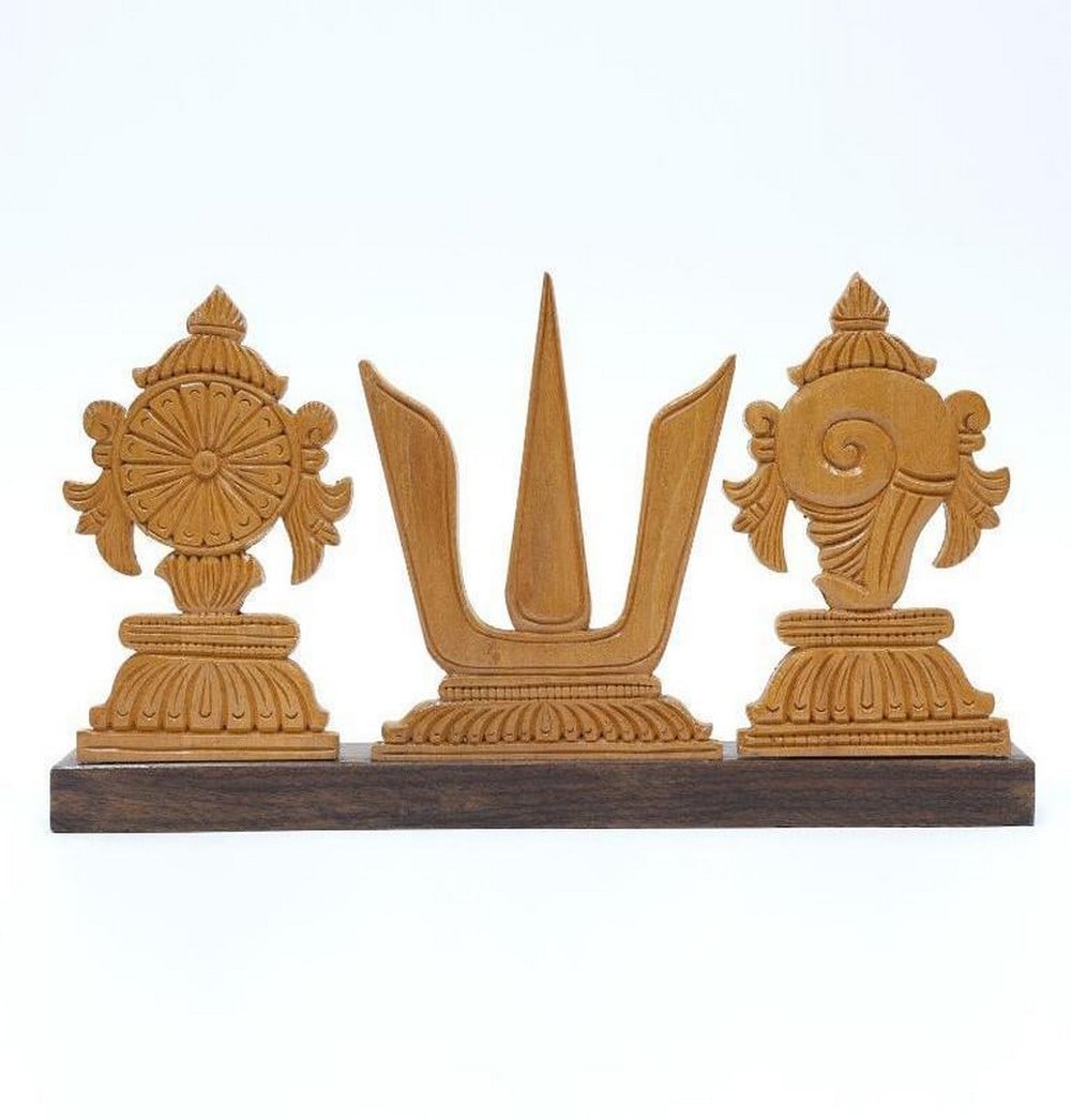 10" Vaishnava Symbols Chakra Tilak and Shankh Wood Carved Statue: 10" Vaishnava Symbols Chakra Tilak and Shankh Wood Carved Statue This finely crafted wooden piece features three sacred symbols of Vaishnavism—the Chakra, Tilak, and Shankh—each