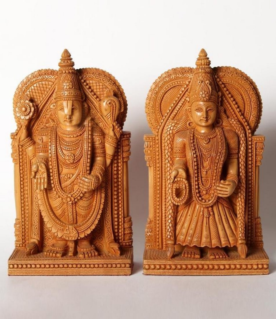 9" Lord Tirupati Balaji and Goddess Padmavati Wooden Statue Set: 9" Lord Tirupati Balaji and Goddess Padmavati Wooden Statue Set This finely handcrafted wooden set features Lord Venkateswara (Balaji) and Goddess Padmavati, capturing their divine presence