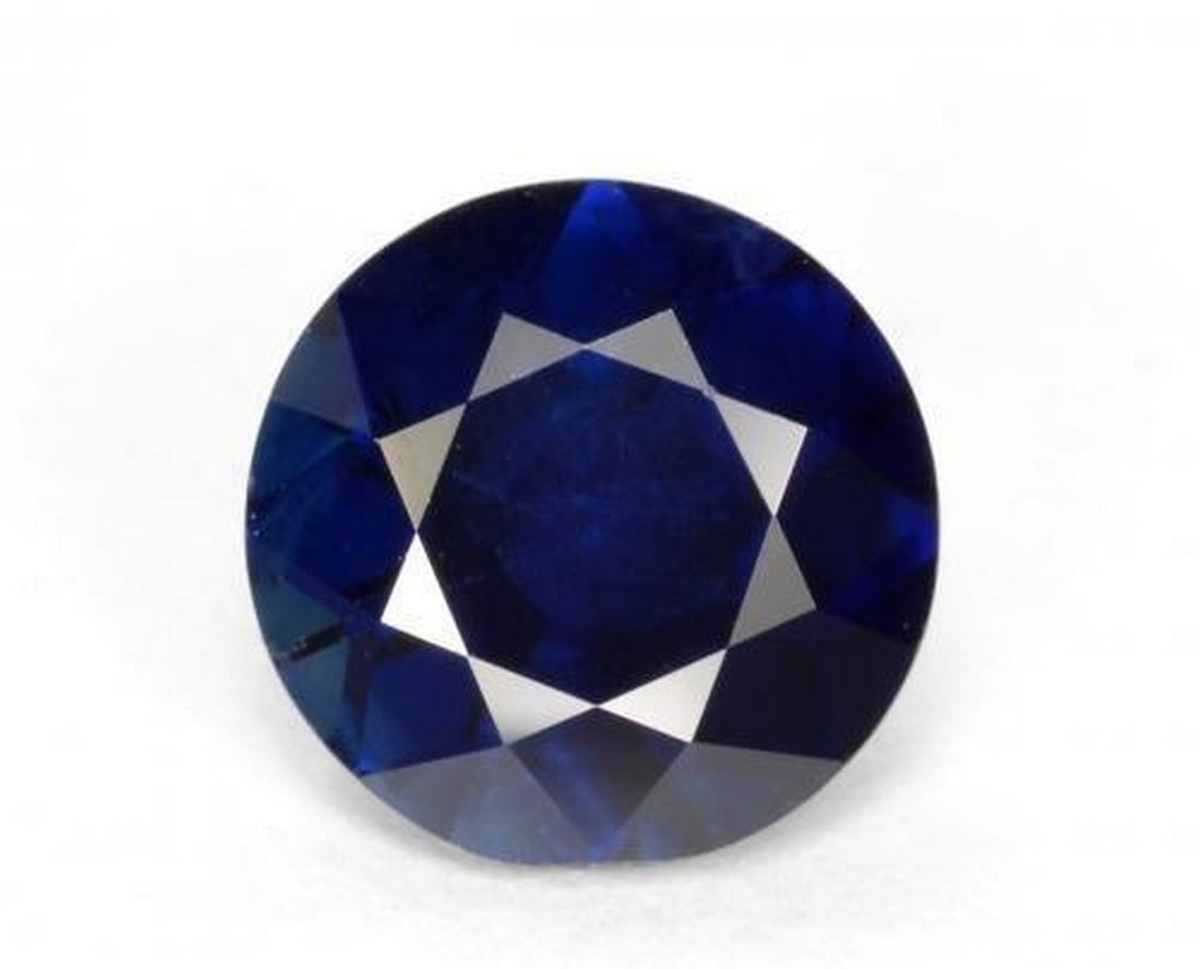 0.56 ct Natural Dark Blue Sapphire, Round Diamond-Cut, VS, Madagascar: 0.56 ct Natural Dark Blue Sapphire, Round Diamond-Cut, VS, Madagascar Natural sapphire gemstone weighing 0.56 carats, cut in a round diamond-cut facet with a dark blue color. The gem measures