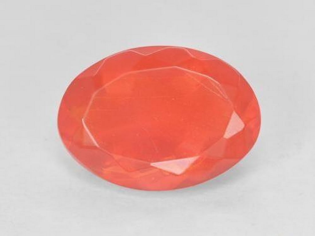 2.71ct Natural Intense Red Orange Fire Opal, Oval Facet, Transparent, Mexico: 2.71ct Natural Intense Red Orange Fire Opal, Oval Facet, Transparent, Mexico Natural fire opal gemstone weighing 2.71 carats, cut in an oval facet shape with a vivid red-orange color and transparent