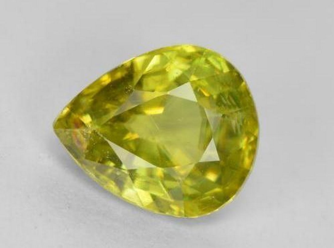 1.56 ct Natural Warm Forest Green Sphene, Pear Facet, VS-SI, Sri Lanka: 1.56 ct Natural Warm Forest Green Sphene, Pear Facet, VS-SI, Sri Lanka Natural Sphene gemstone weighing 1.56 carats, cut in a pear facet with a warm forest green color. The gem measures approximately