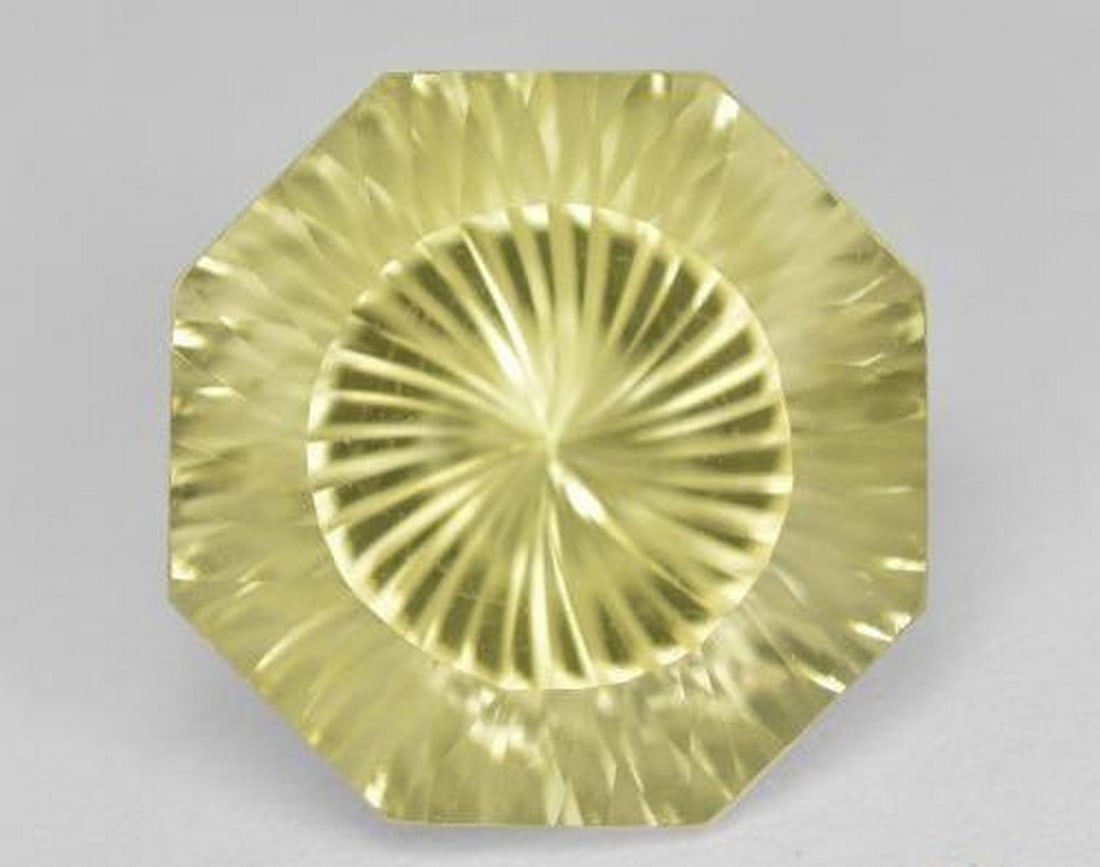 9.14ct Natural Medium Yellow Quartz, Octagon VVS: 9.14ct Natural Medium Yellow Quartz, Octagon VVS A striking 9.14 carat natural quartz, expertly cut in an octagon concave (emerald) shape. This gem showcases a medium yellow color with exceptional bri