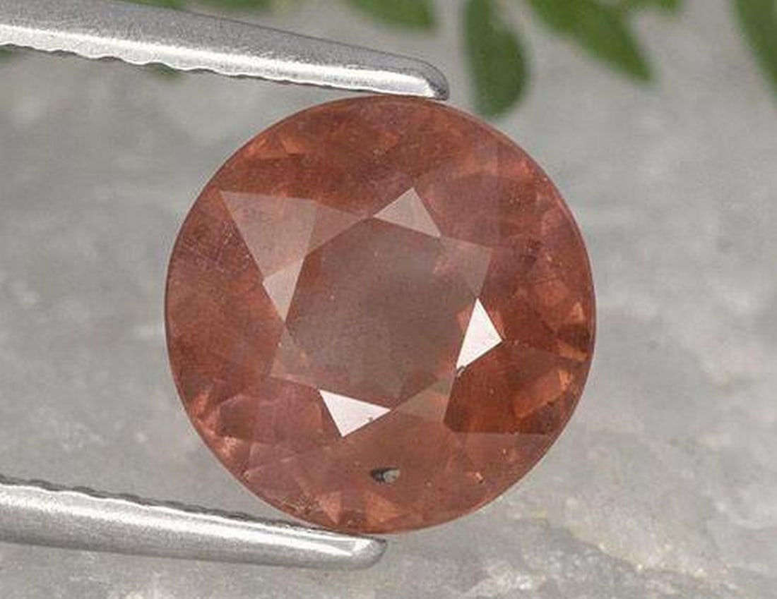 2.56ct Natural Raspberry Pink Malaya Garnet, Round, VS: 2.56ct Natural Raspberry Pink Malaya Garnet, Round, VS A natural Malaya garnet weighing 2.56 carats, cut in a round facet with a vivid raspberry pink hue and fine VS clarity. Measuring 8.04 x 5.03 mm,