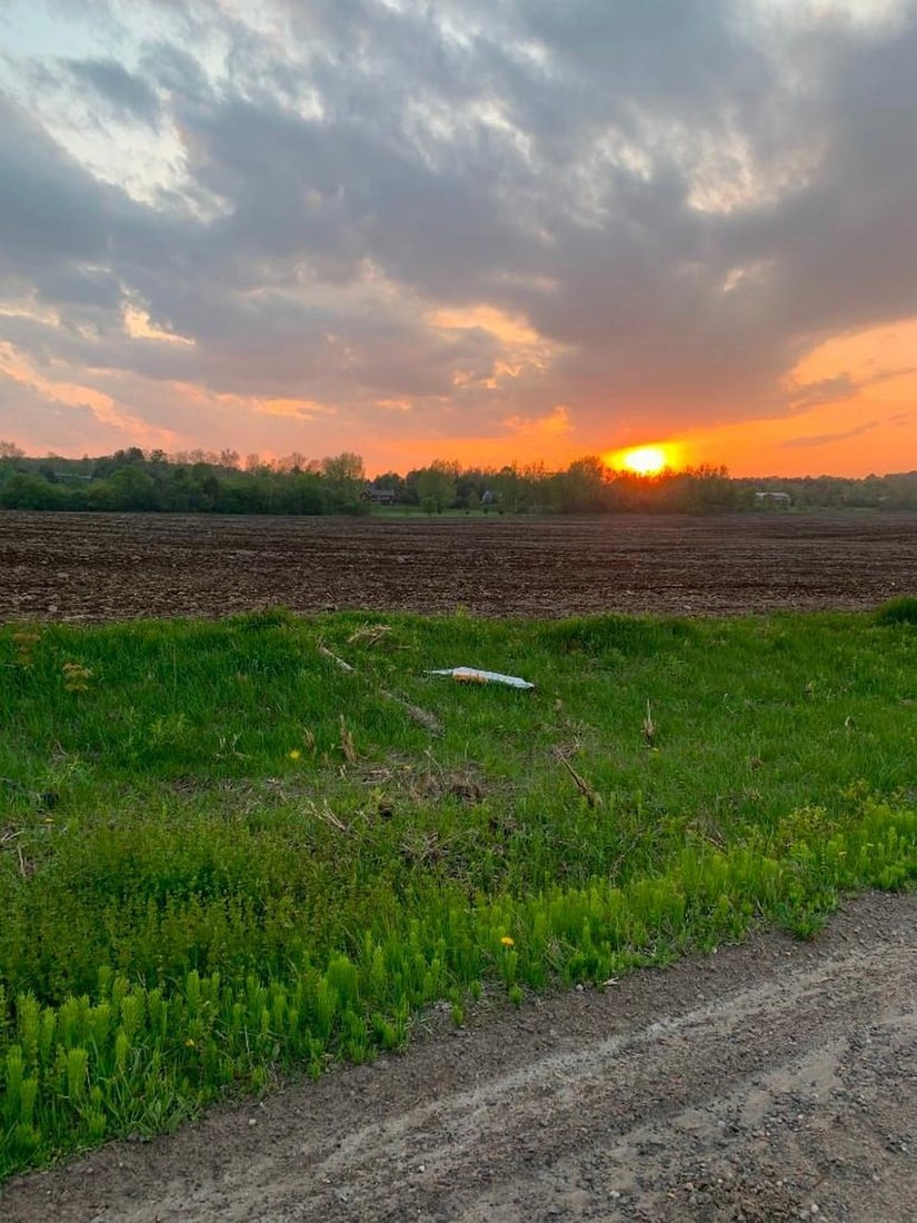 Fiery Sunset Over the Fields: Fiery Sunset Over the Fields Capture the dramatic beauty of a countryside sunset with this exclusive hand-painted canvas opportunity. The photograph showcases a glowing orange sun setting behind a