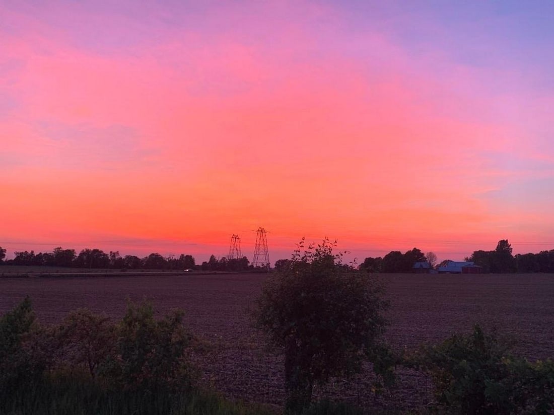 Sunset Over the Fields: Sunset Over the Fields Celebrate the striking beauty of rural landscapes at dusk with this exclusive hand-painted canvas opportunity. The photograph captures a wide-open farm field stretching