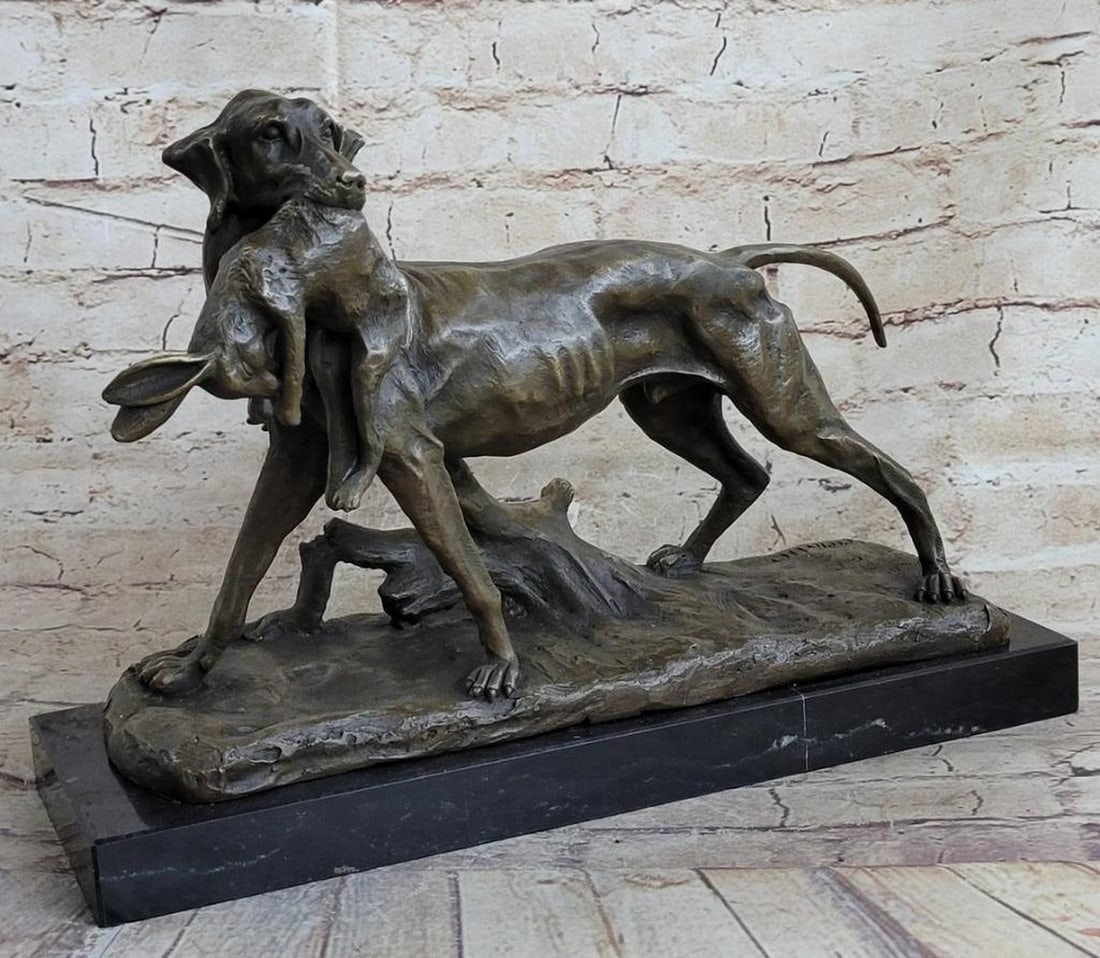 Hunting Dog Carrying Rabbit Inspired Bronze Statue - 10" x 15": Hunting Dog Carrying Rabbit Inspired Bronze Statue - 10" x 15" Step into the serene world of the hunt with this captivating bronze sculpture featuring a hunting dog in the mist of an early mo