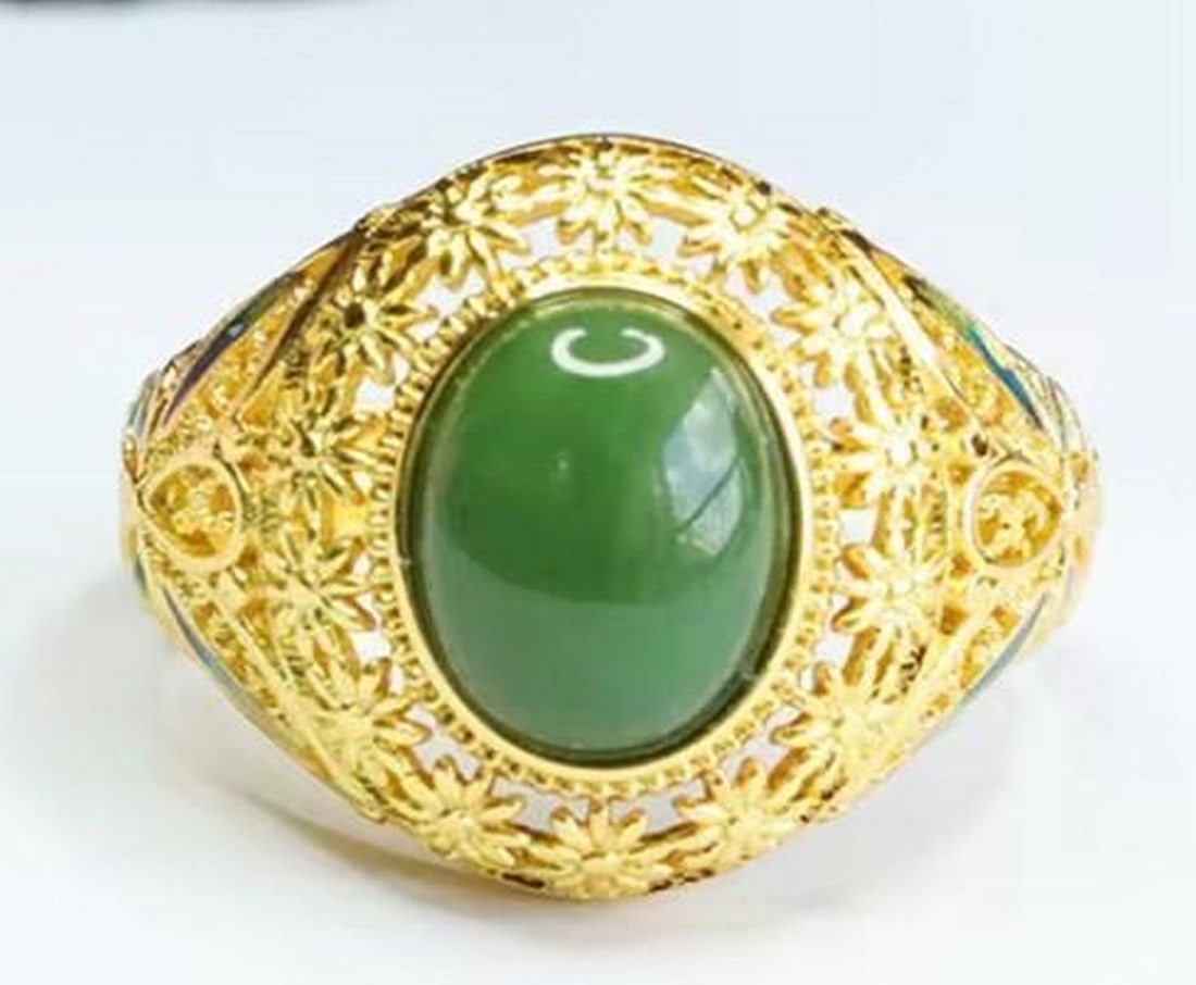 Hollow-Out Flower Jade Ring: Hollow-Out Flower Jade Ring This stunning ring features a delicate hollow-out flower design crafted from jade and set on a gold-plated band. Elegant and lightweight, it blends natural beauty with