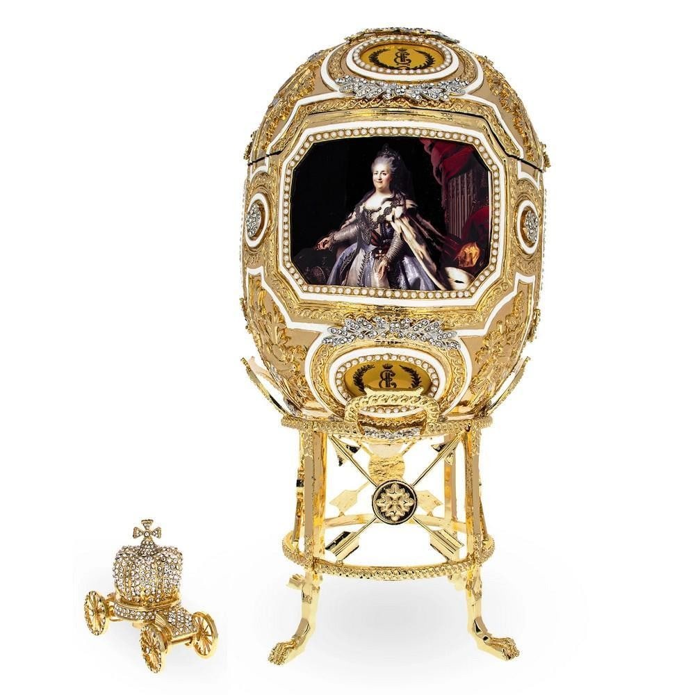 Inspired 1914 Grisaille Royal Imperial Egg with Stand: Inspired 1914 Grisaille Royal Imperial Egg with Stand This hand-painted, openable egg is crafted from gold-plated pewter and encrusted with Austrian crystals, featuring intricate enamel detailing. Spe