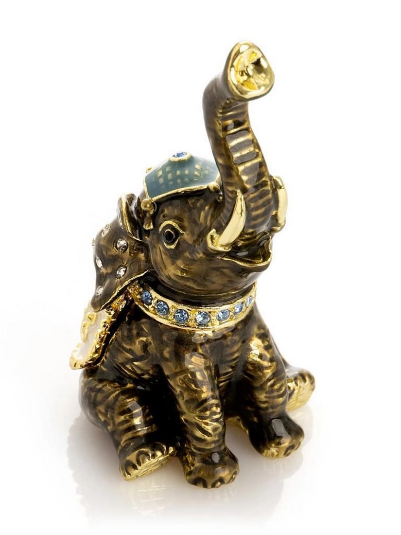 Elephant Trinket Box 24K Gold Plated: Elephant Trinket Box 24K Gold Plated This enamel-painted trinket box captures the elegance and majesty of elephants in miniature form. Handcrafted and plated with 24K gold, the piece features a detail