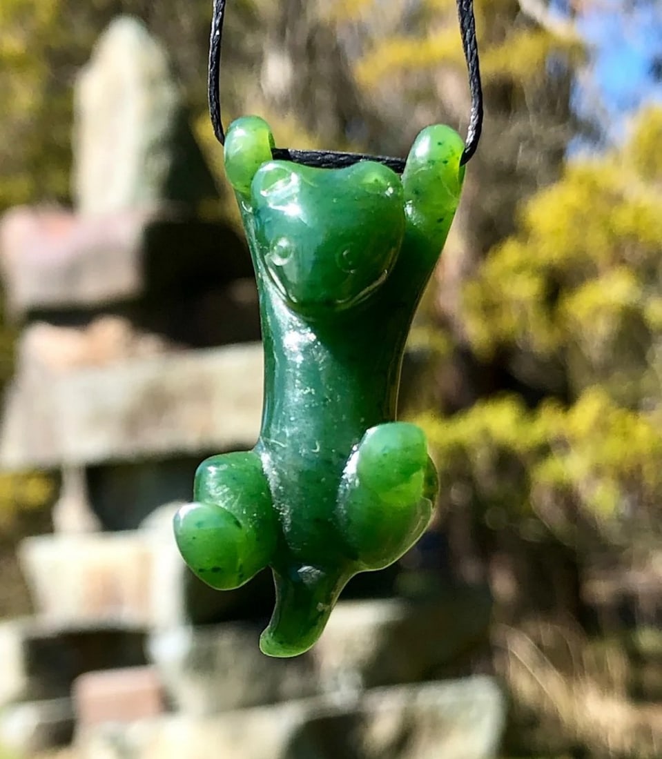 Canadian Nephrite Hanging Spirit Animal: Canadian Nephrite Hanging Spirit Animal This pendant is hand-carved from genuine Canadian Nephrite Jade, designed to represent a spirit animal in a suspended form. The polished finish enhances the dee