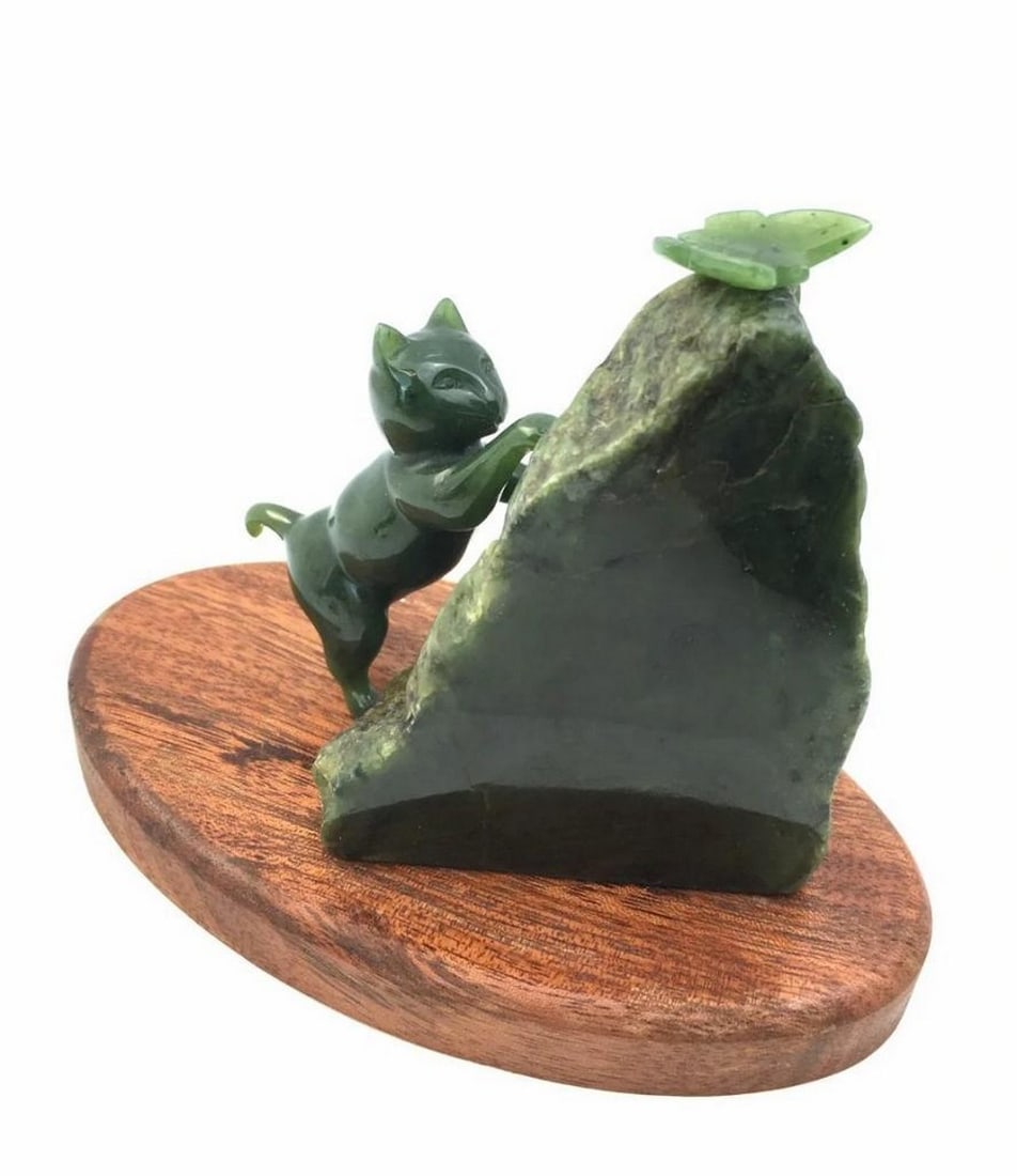 Cat Chasing Butterfly – Canadian Nephrite Jade, High Polish: Cat Chasing Butterfly – Canadian Nephrite Jade, High Polish Intricately carved jade sculpture showing a cat playfully reaching for a butterfly in motion. Crafted from Canadian nephrite jade with a h