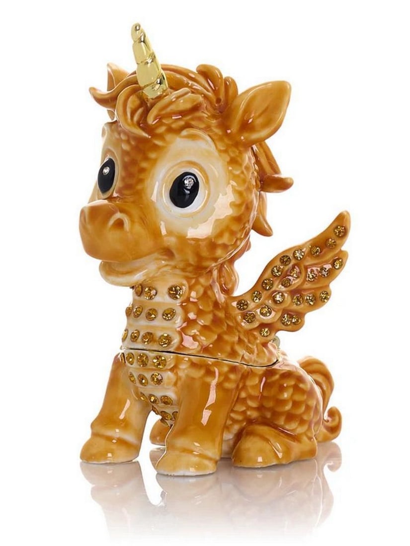 Enchanted Brown Unicorn Trinket Box: Enchanted Brown Unicorn Trinket Box This exquisite enamel-painted trinket box is a handcrafted masterpiece, adorned with handpicked Austrian crystals and finished with 24K gold plating. The piece is i