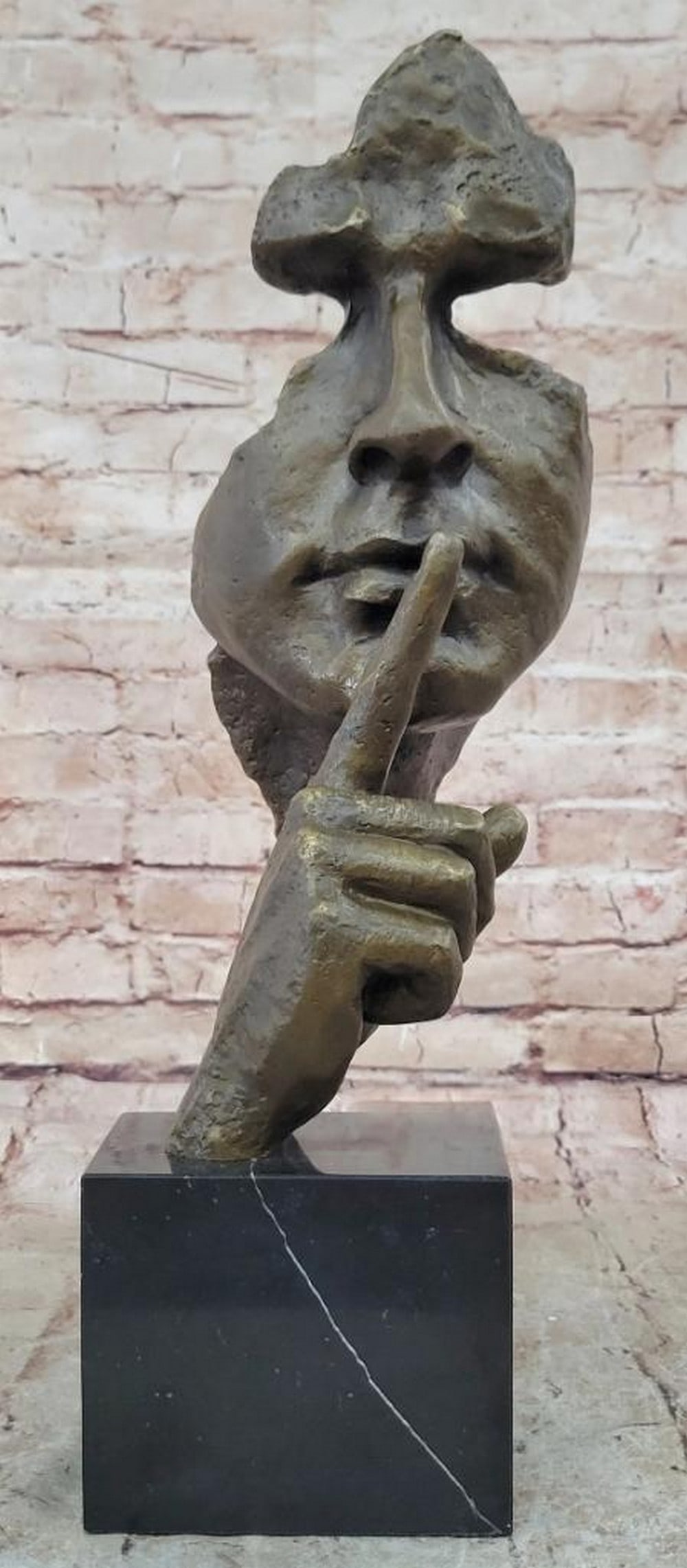 Silence" Abstract Dali-Inspired Bronze Face Sculpture – 18" x 7: "Silence" Abstract Dali-Inspired Bronze Face Sculpture – 18" x 7" Inspired by the surrealist vision of Salvador Dalí, this abstract bronze sculpture titled Silence portrays a
