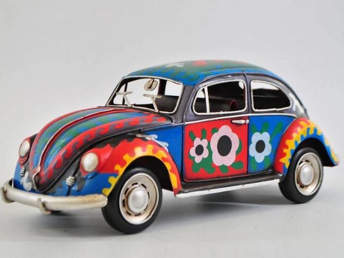 Flower Power: 1934 VW Beetle: Flower Power: 1934 VW Beetle This colorful, hand-painted model of the 1934 VW Beetle brings a vibrant burst of nostalgia, blending the iconic charm of the classic car with the spirit of the '60s