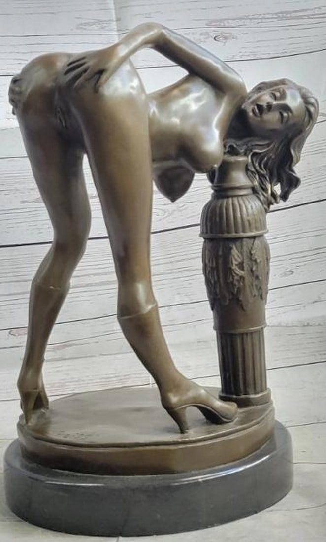 Revealed Grace Erotic Bronze Sculpture: Revealed Grace Erotic Bronze Sculpture An intimate and sensuous bronze sculpture portraying a nude woman in a provocative, bending pose that emphasizes the curves of the female form. With graceful li
