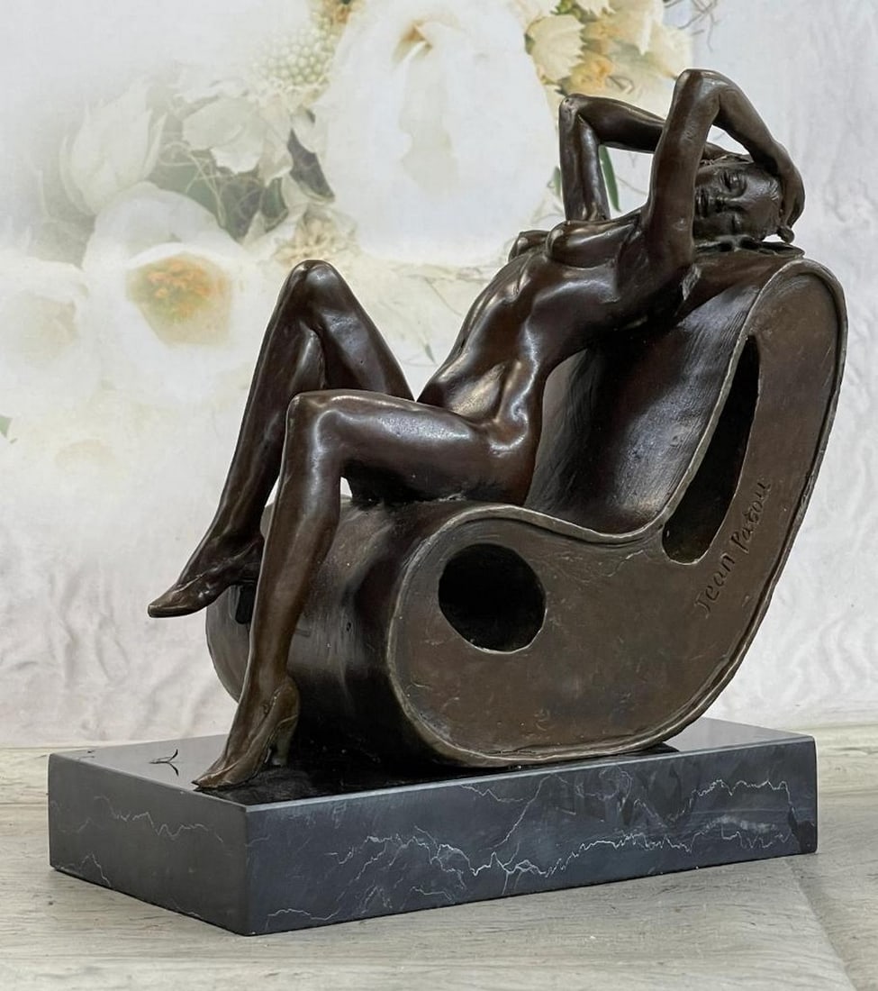 Nude Lady Sun Bathing Bronze Sculpture: Nude Lady Sun Bathing Bronze Sculpture Radiating peace and natural beauty, this bronze sculpture captures a nude woman in a serene sunbathing pose. Her body reclines gracefully, with relaxed limbs a