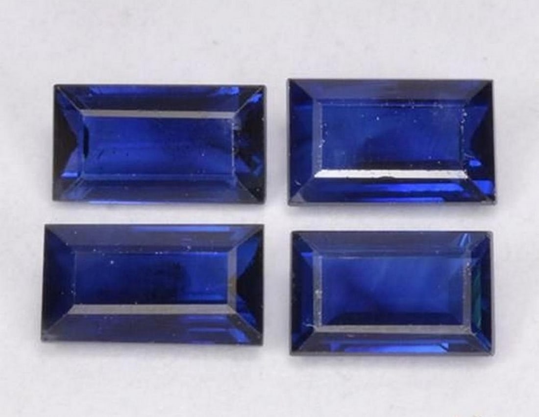 1.63 ct Baguette Step Cut Twilight Blue Sapphire Gemstones: 1.63 ct Baguette Step Cut Twilight Blue Sapphire Gemstones Introducing our set of four natural Blue Sapphire gemstones, totaling 1.63 ct, each expertly faceted in a baguette step cut to showcase