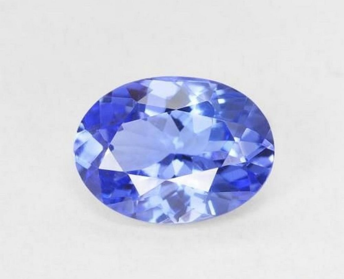 1.31 ct Natural Deep Violet Blue Tanzanite, Oval Facet, VVS, Tanzania: 1.31 ct Natural Deep Violet Blue Tanzanite, Oval Facet, VVS, Tanzania Natural tanzanite weighing 1.31 carats, cut in an oval faceted form with a rich deep violet-blue color. The gemstone measures