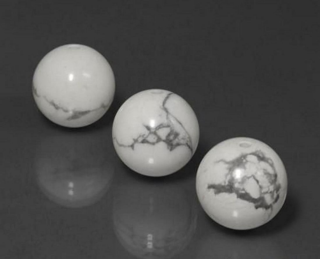 69.17 ct Drilled Sphere White Howlite Gemstones: 69.17 ct Drilled Sphere White Howlite Gemstones Introducing our set of three natural White Howlite gemstones, totaling 69.17 ct, each crafted into a drilled sphere with a calibrated size of 14 mm. Th