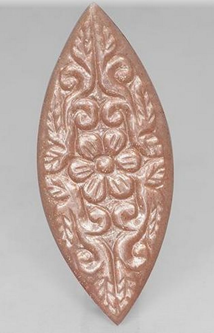 Peach Orange Carved Marquise Moonstone with Floral Design: Peach Orange Carved Marquise Moonstone with Floral Design Elegantly carved into a graceful marquise shape, this peach orange Moonstone features a delicate floral design that enhances its natural beau