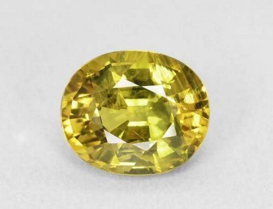 2.31ct Oval Cut Yellow Sapphire: 2.31ct Oval Cut Yellow Sapphire A radiant medium yellow sapphire with an oval facet, VVS-VS clarity, and be-heated to enhance color. Known to bring prosperity, confidence, and mental clarity,