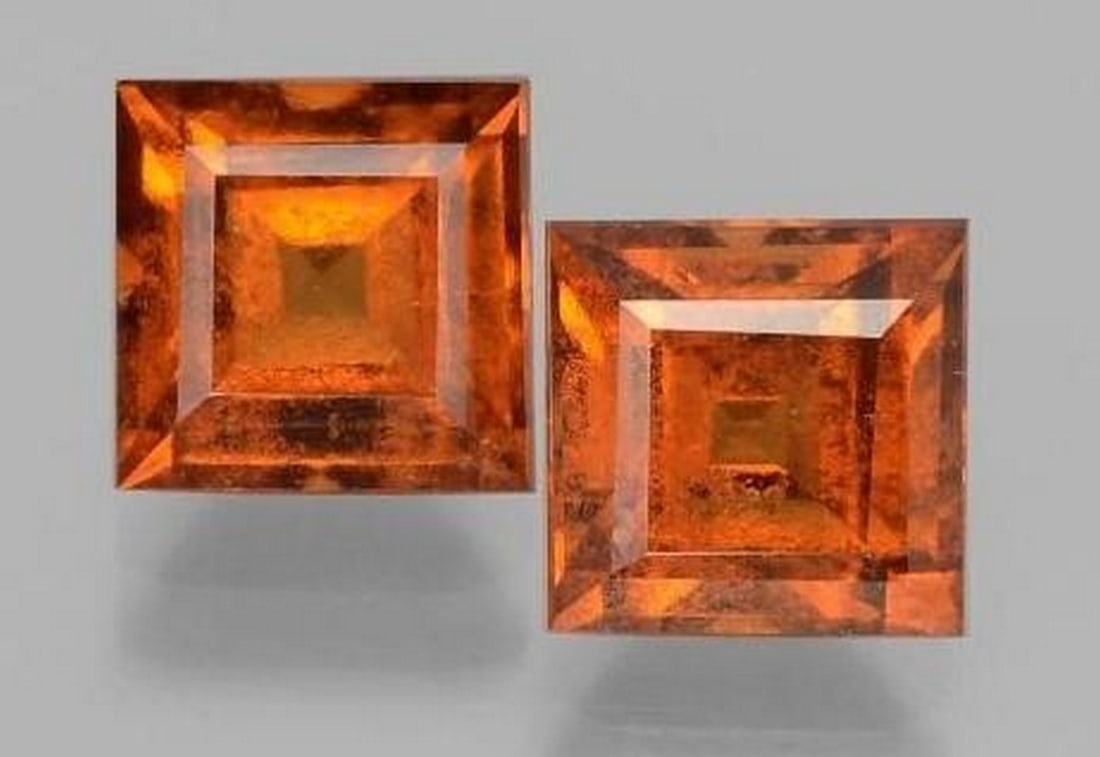 Two Radiant Square-Cut Reddish Orange Hessonite Garnet Loose Gemstones: Two Radiant Square-Cut Reddish Orange Hessonite Garnet Loose Gemstones This vivid loose Hessonite Garnet glows with warm, reddish-orange tones, expertly cut into a symmetrical square facet that