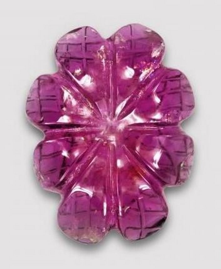 Dark Red Rubellite Tourmaline Carved Flower Gemstone: Dark Red Rubellite Tourmaline Carved Flower Gemstone This striking loose gemstone is carved from deep red rubellite tourmaline into a beautifully detailed flower design. The rich, velvety color radia