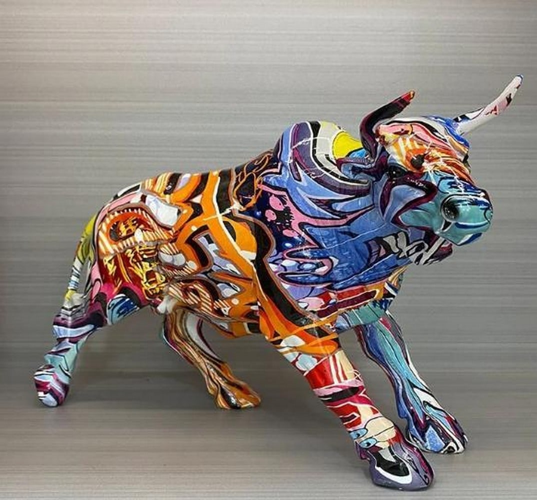 Graffiti Bull Sculpture in Resin: Graffiti Bull Sculpture in Resin A powerful symbol of strength and momentum, this standing bull sculpture is cast in high-quality resin and brought to life with vivid graffiti-style artwork. The bold