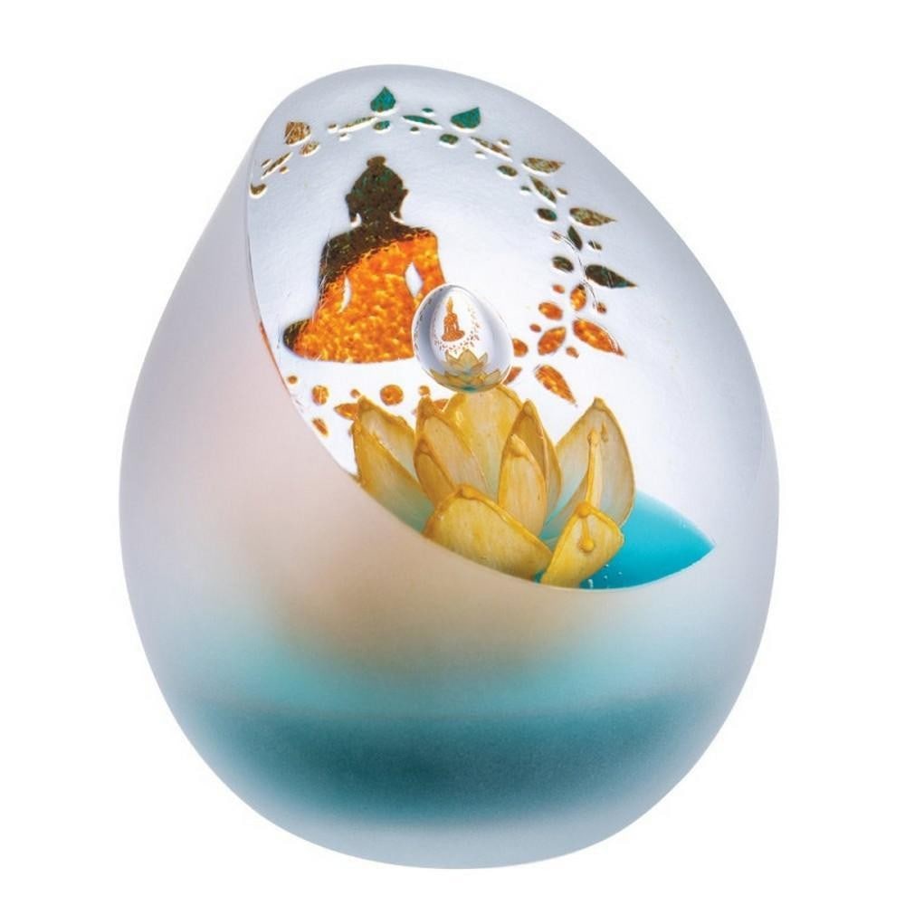 Tranquil Lotus Paperweight: Tranquil Lotus Paperweight A handcrafted glass paperweight featuring symbolic lotus flowers floating serenely above murky waters, representing purity and tranquility. Its calming design makes it a con