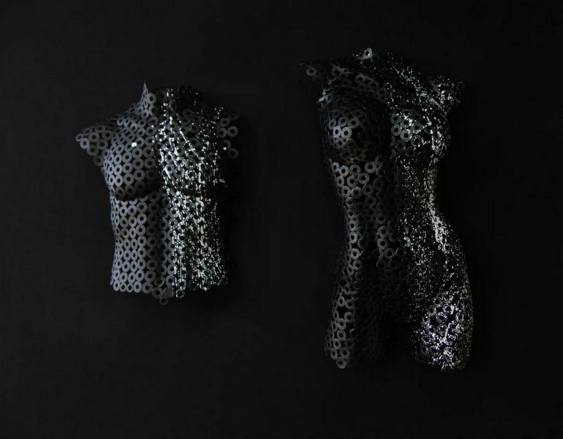 Symphony of Love - Pair of Male and Female Torso Sculptures: Symphony of Love - Pair of Male and Female Torso Sculptures Symphony of Love is a stunning pair of metal sculptures that explore the harmony between masculine and feminine energies. The female torso,