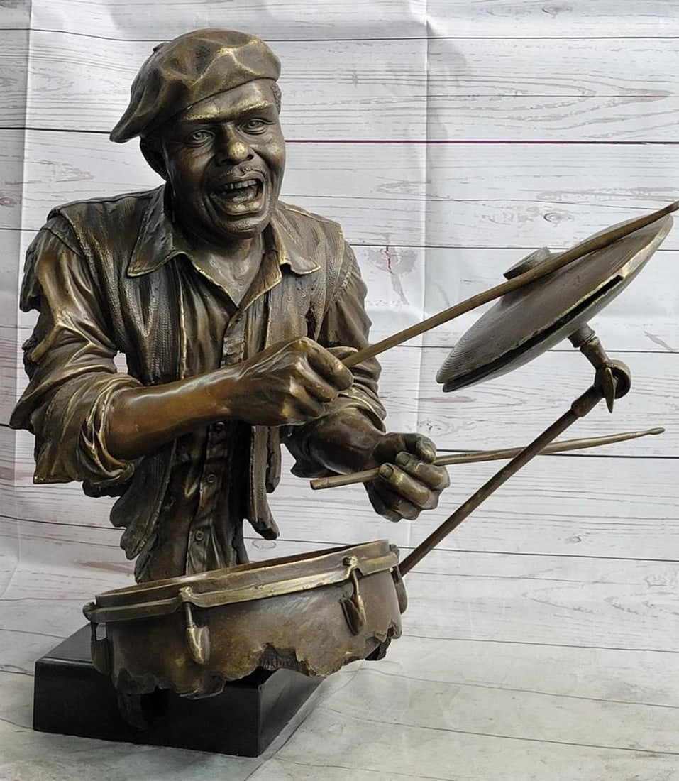 Rhythm in Bronze Drummer Sculpture – 19" x 19": Rhythm in Bronze Drummer Sculpture – 19" x 19" This original bronze sculpture captures the raw intensity and rhythm of a drummer fully immersed in performance, with expressive movement and f